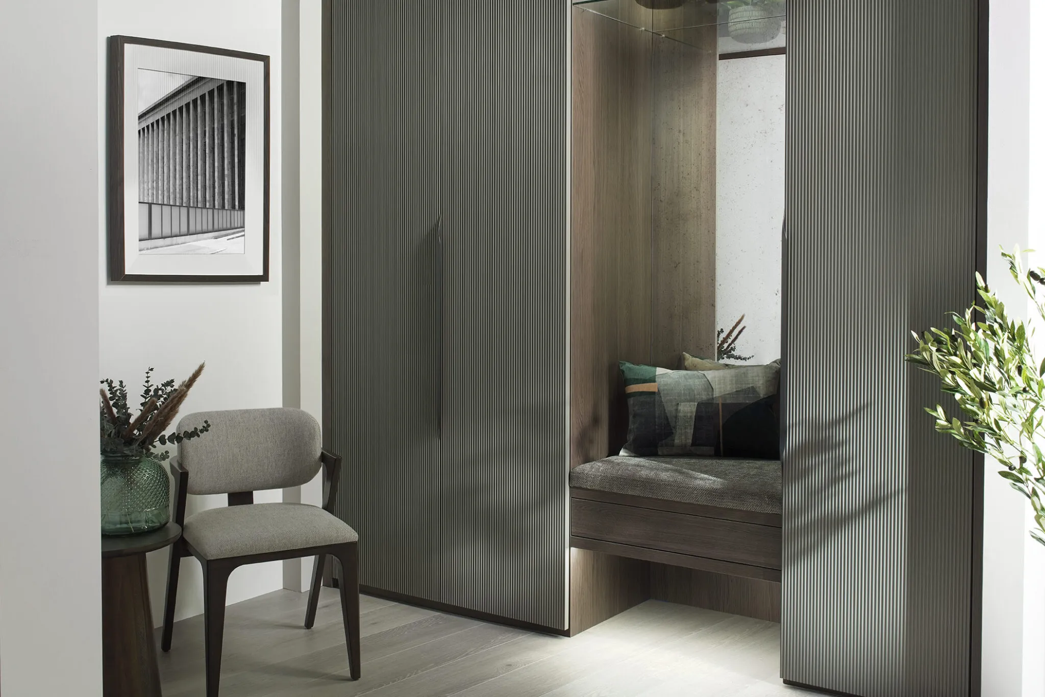 fitted wardrobes with inset seating and chair.