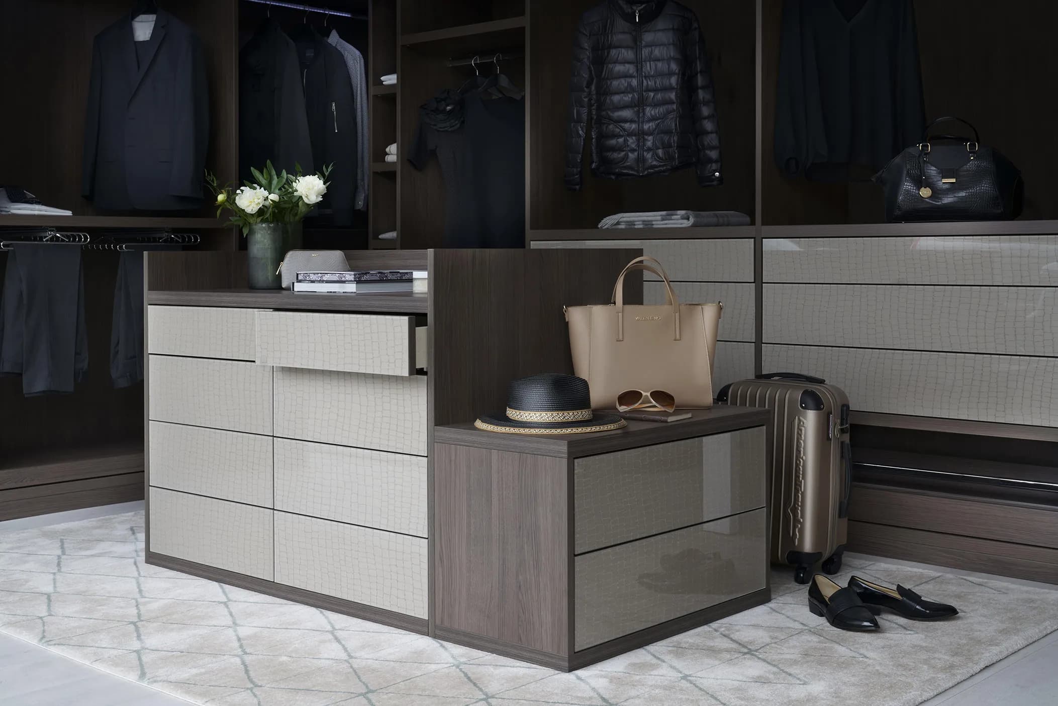 Dressing room island unit with drawers and a mirrored top, and open hanging space behind