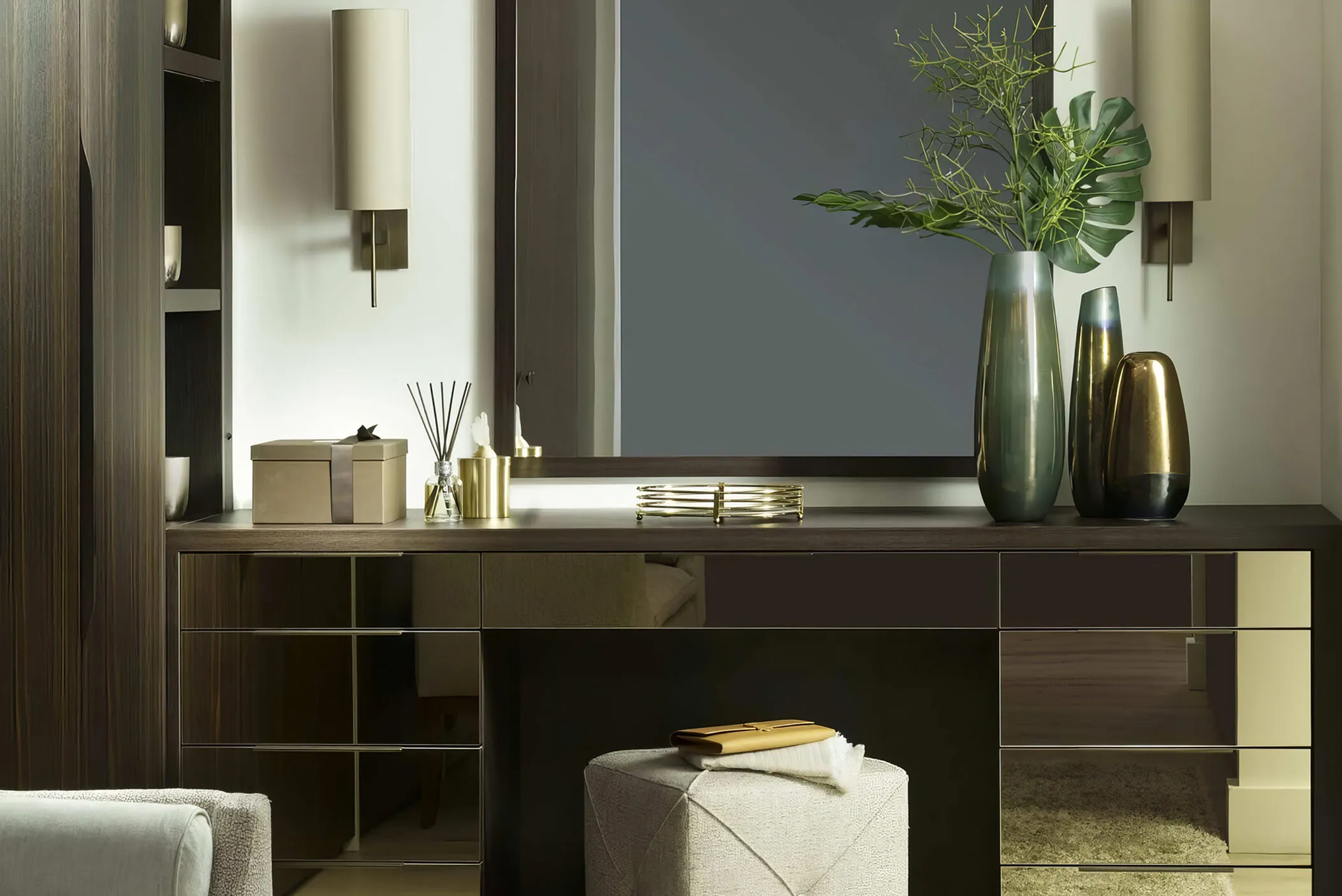 Dressing table with brass-edged mirrored drawer fronts, vases and a mirror, with upholstered stool