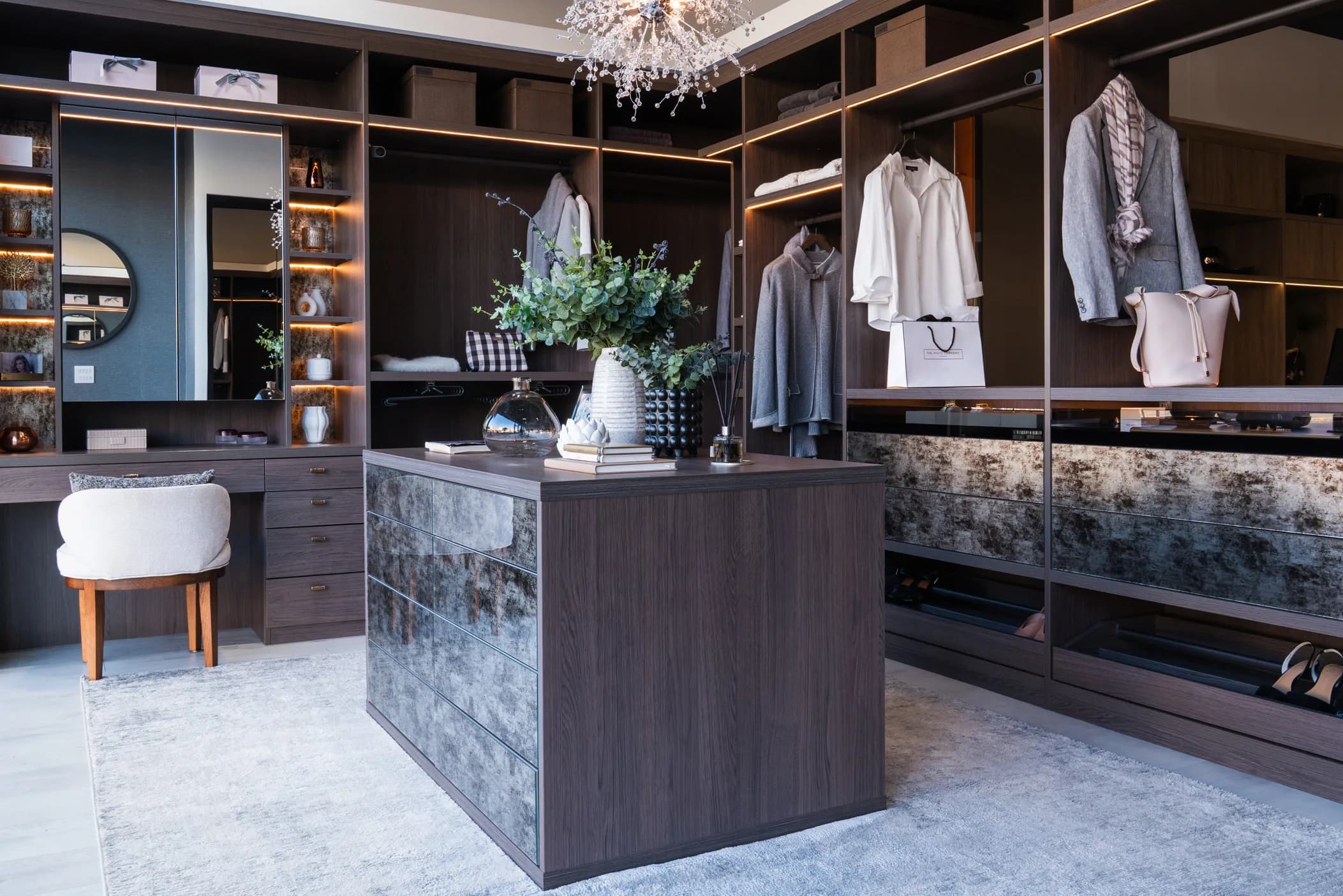 Dressing room island unit with antiqued mirror front, dressing table and shelving
