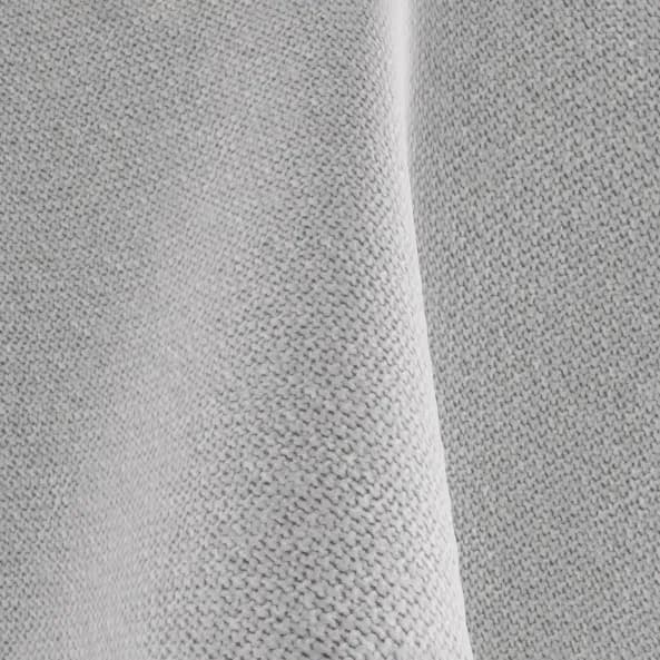 Close-up of light grey woven bed upholstery fabric