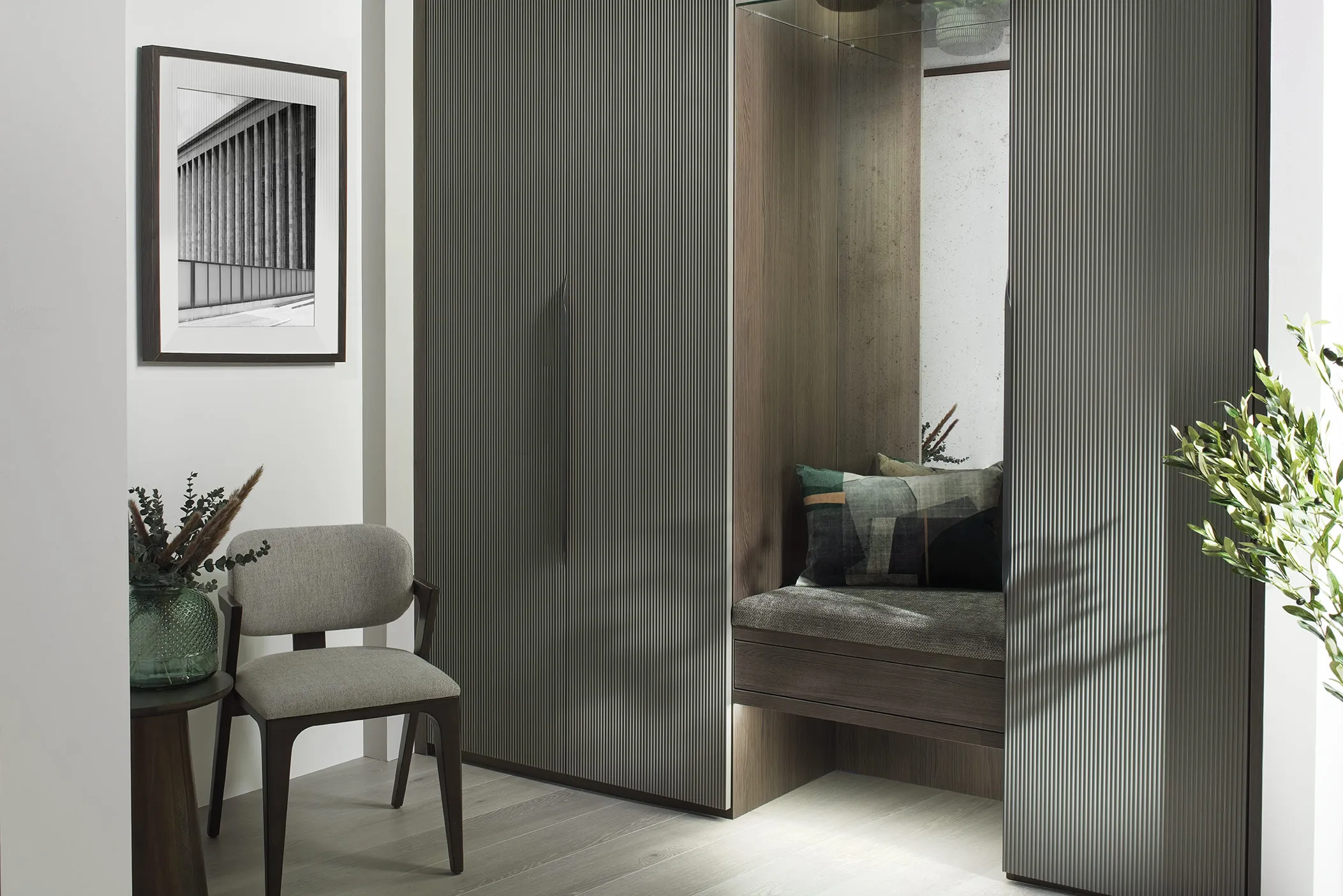 fitted wardrobes with inset seating and chair.