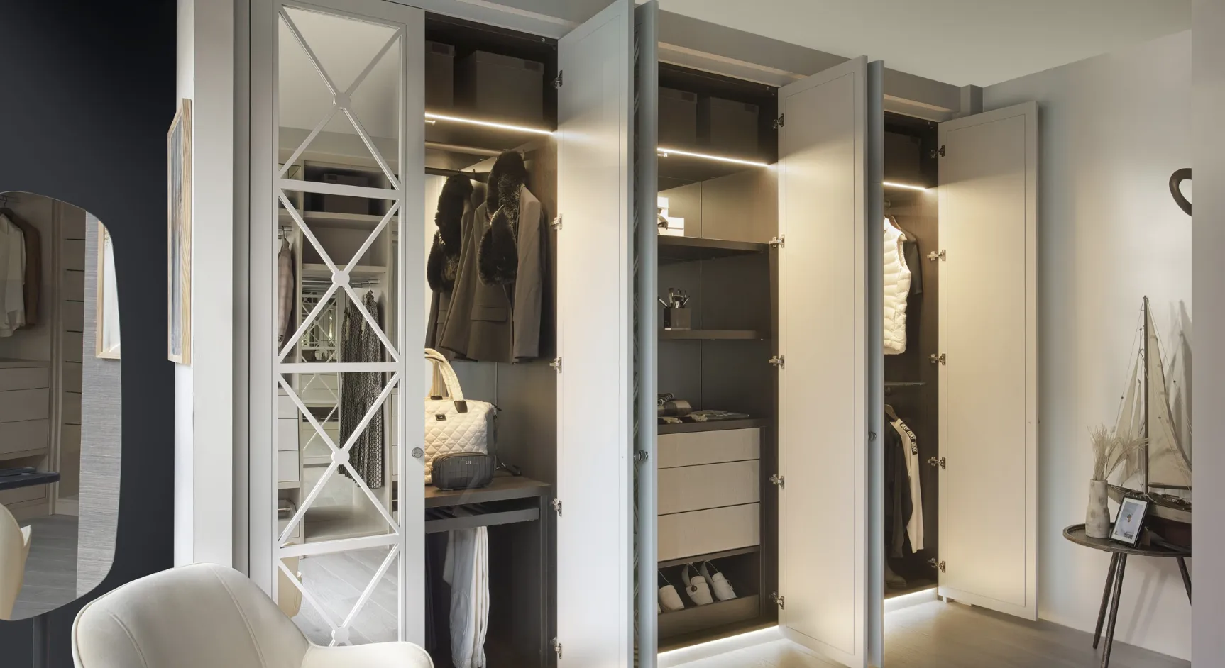 Fitted wardrobes with cross-pattern mirrored door, open doors and LED lighting inside