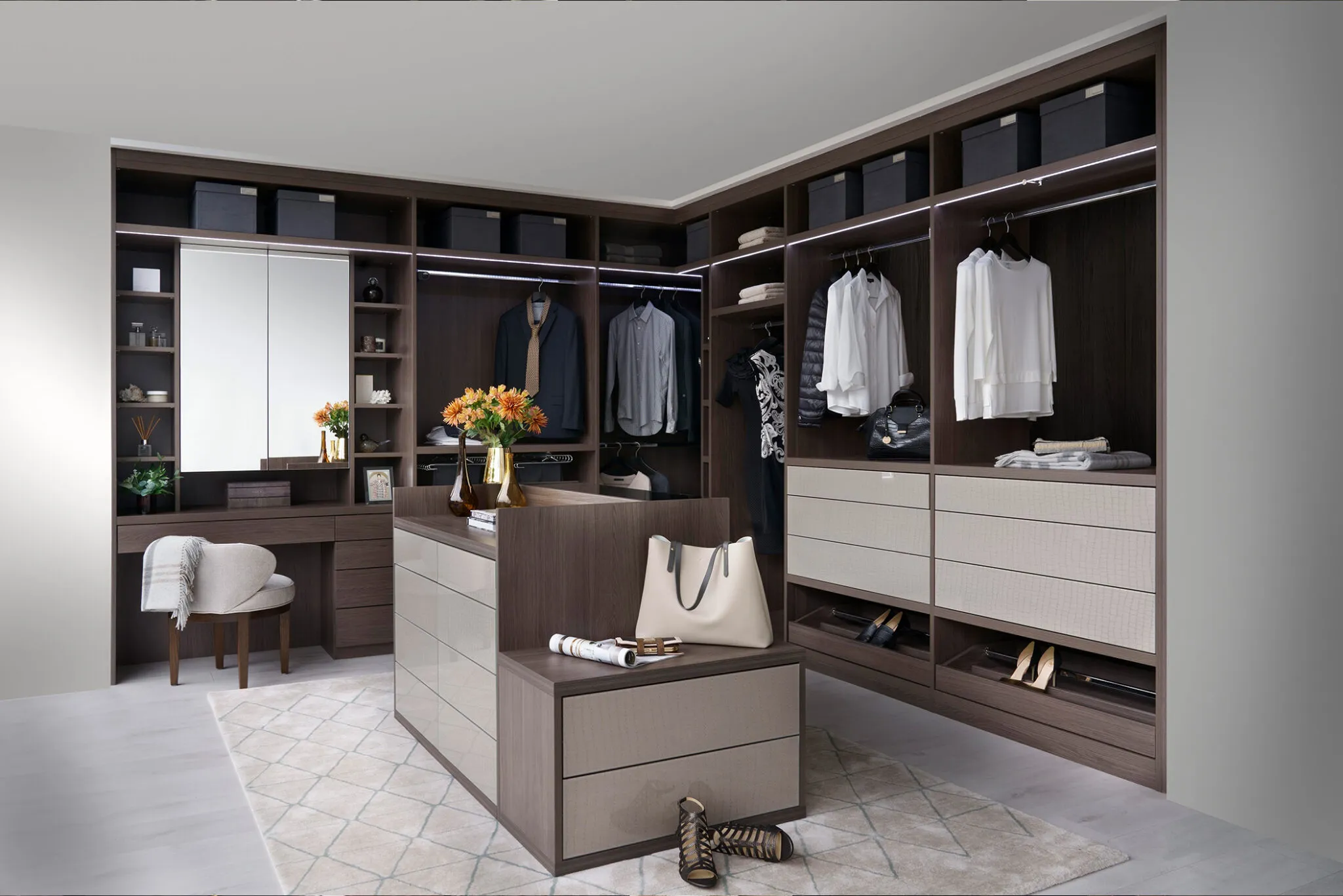 Corner walk-in wardrobe with central island, mirrored dressing table, shelving and drawers
