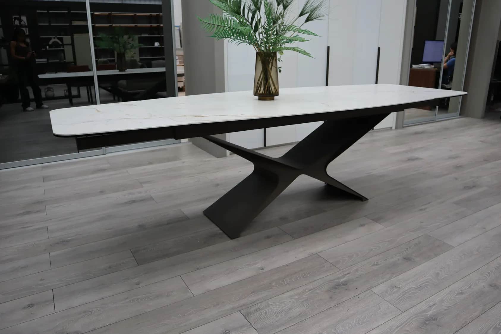 Marble-effect dining table with an angular dark metal base