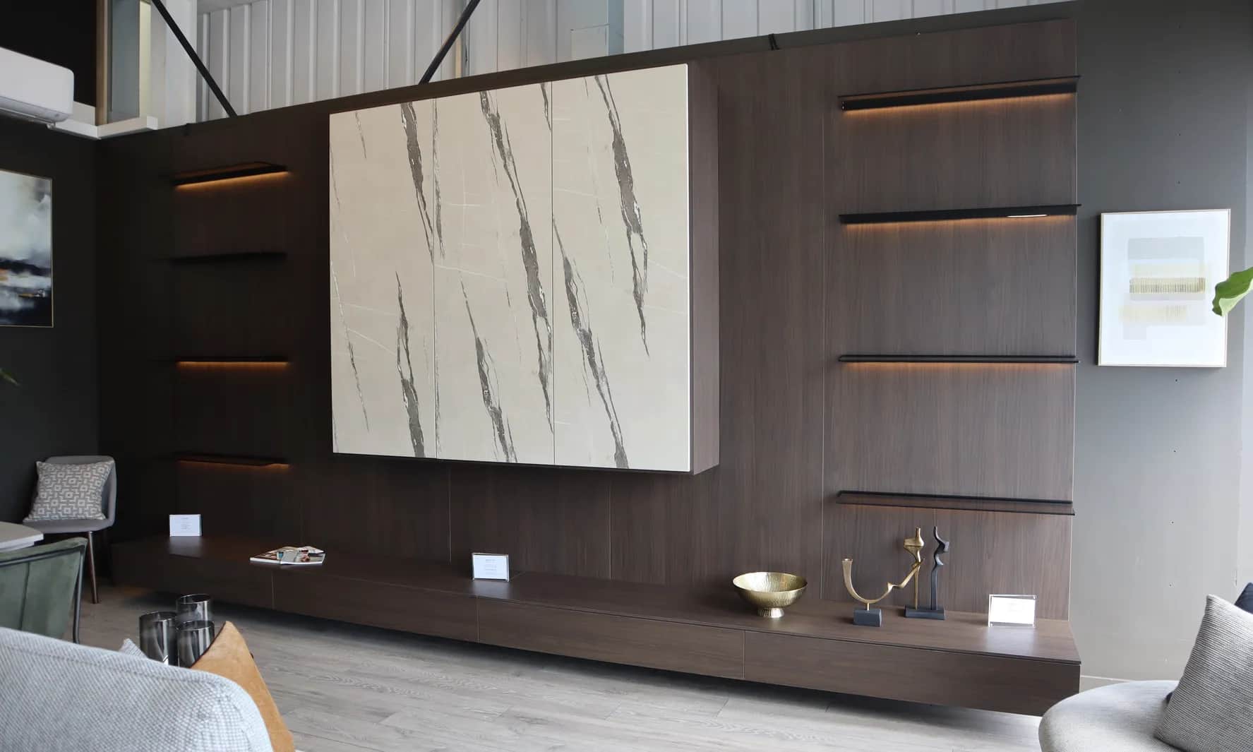 Living room wall unit with marble-effect panel and LED-lit floating shelves