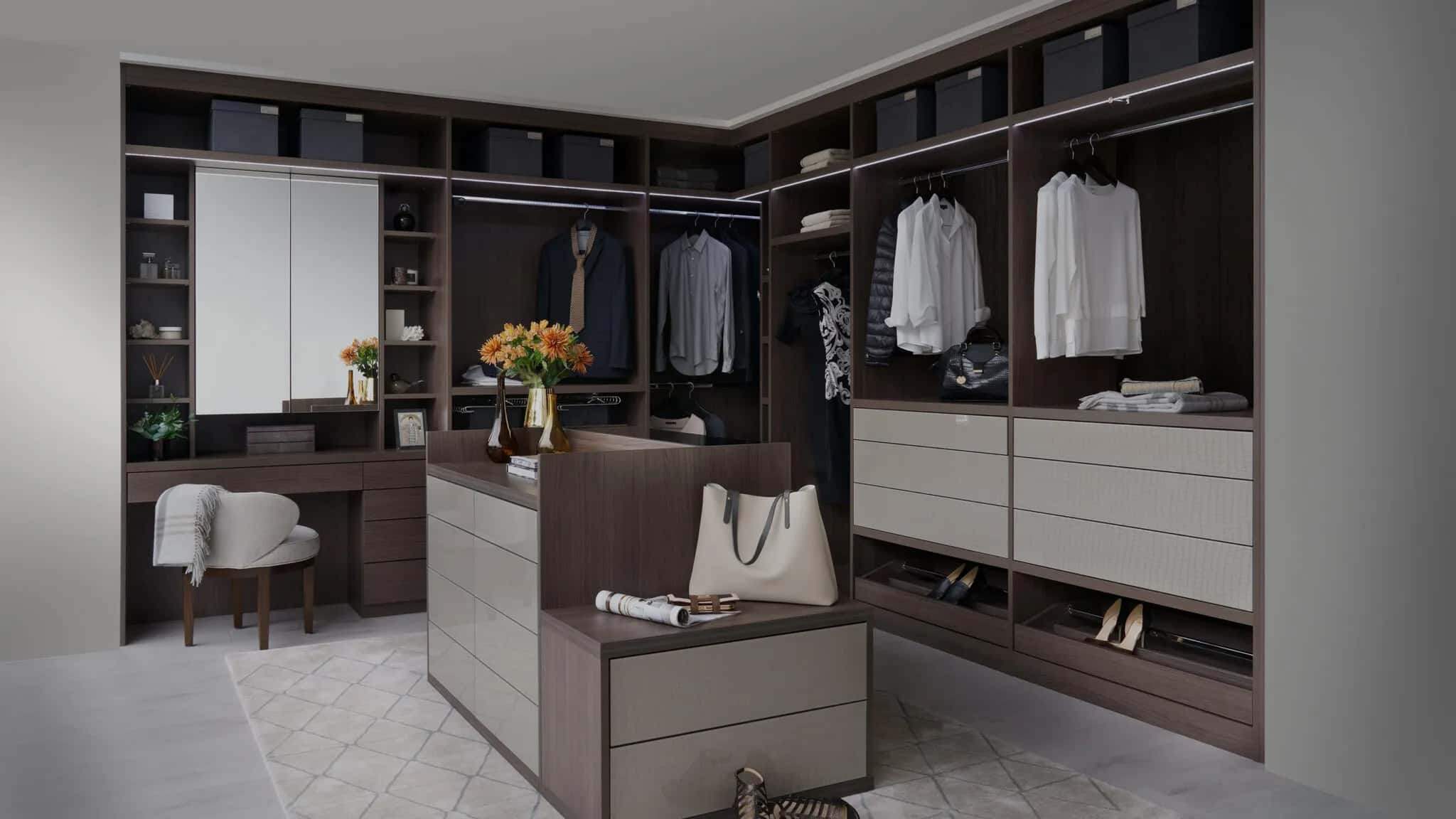 Corner walk-in wardrobe with central island, dressing table, open shelving and hanging space