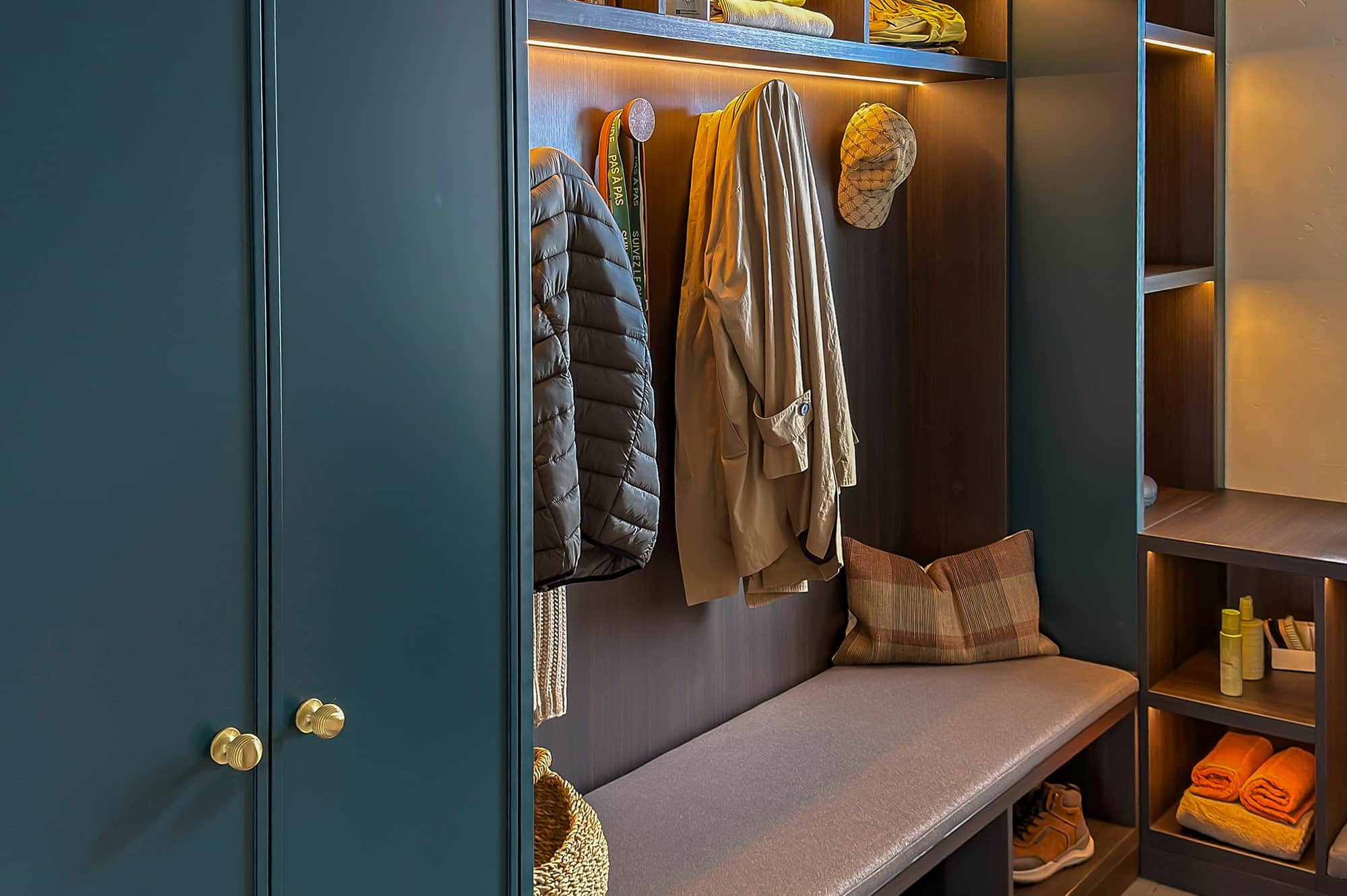 Bespoke boot room with bench seat, cupboards and coat hooks
