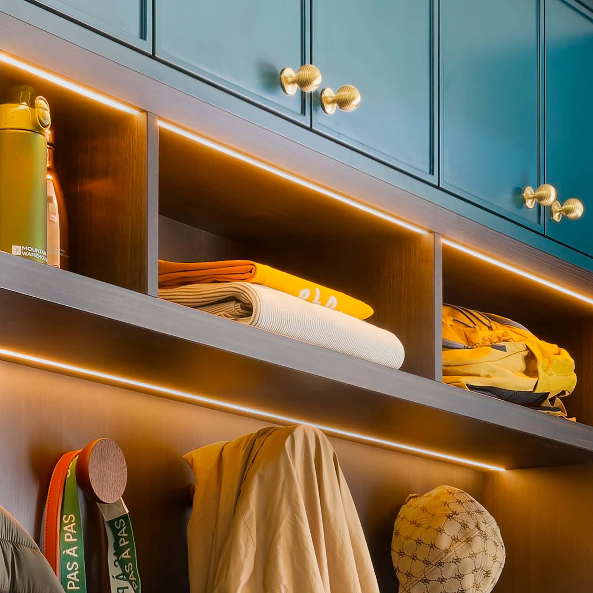 Integrated LED lighting in bespoke boot room shelving